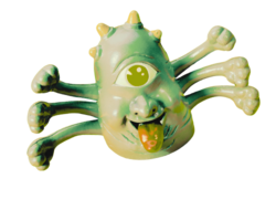 a very cute lil green-eyed many-armed monster toy