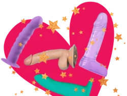 Four various dildos (two purple, one blue, and one flesh colored) against a bright pink heart with gold sparkly stars all around them