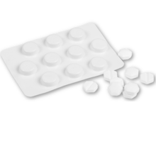 A blister pack of pills with loose pills spilled next to it. They look vaguely like misoprostol which is one of the medications used in medical abortions.